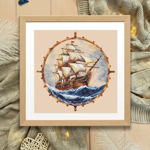 May include: A framed cross-stitch artwork depicting a vintage sailing ship with white sails, surrounded by a brown wooden ship's wheel. The ship is sailing on a blue ocean with white waves.