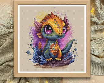May include: Cross stitch pattern of a cute, cartoon dragon with yellow, orange, and blue scales. The dragon has large, purple eyes and is surrounded by purple and blue flowers.