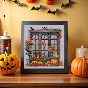 May include: A framed cross-stitch design depicting a window with a spooky Halloween scene. The window is decorated with autumn foliage and pumpkins. There are also candles and a spider's web in the scene.