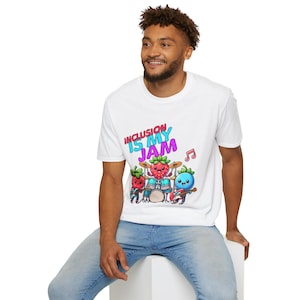 May include: White t-shirt with the text "INCLUSION IS MY JAM" in colorful letters. The shirt features a cartoon band of anthropomorphic strawberries playing instruments. A musical note is also included in the design.