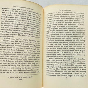 May include: A page from a book about the history of music in Vienna, featuring a black and white image of a page of text. The text discusses the opera "Die Meistersinger" by Richard Wagner, and the performance of the opera in Vienna. The text includes the words "The Feast of St. John", "Magdalena", "Pogner", "Eva", "Sachs", "Beckmesser", "Walther", "Jerum! Holla, Holla ho!" and "Gl&uuml;hw&uuml;rmchen".