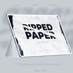 Puede incluir: Una tableta digital muestra un gráfico con el texto "RIPPED PAPER TRANSITIONS" en negro sobre un fondo de papel rasgado. La tableta está apoyada en un soporte. El logotipo de Premiere Pro es visible en la esquina superior derecha.