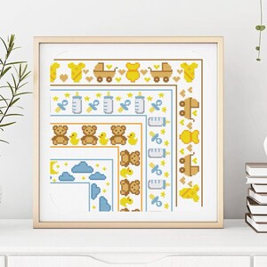 May include: A cross-stitch pattern featuring a variety of baby-themed designs, including teddy bears, baby bottles, stars, and clouds. The pattern is framed in a light wood frame.