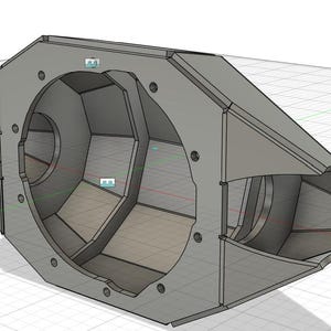 以下が含まれることがあります： 大きな円形の開口部と複数の小さな穴がある、3Dレンダリングされた灰色の幾何学的オブジェクト。このオブジェクトは、内部コンパートメントとテクスチャ加工された外観を備えた複雑な角度のデザインで、機械的または建築的なモデルを示唆しています。