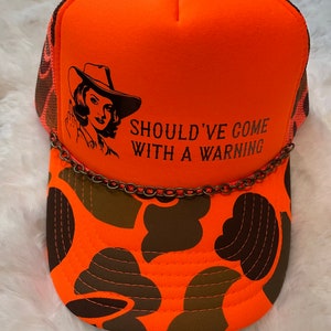 Trucker Hat with Chain: “Should’ve come with a warning”