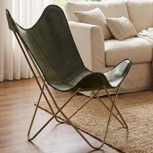modern butterfly chair, luxury leather chair, designer accent chair, handmade furniture, contemporary seating, leather home decor, vintage style chair, minimalist furniture, reading nook chair, industrial modern chair, premium lounge chair, cozy accent chair, artisan furniture