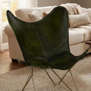 modern butterfly chair, luxury leather chair, designer accent chair, handmade furniture, contemporary seating, leather home decor, vintage style chair, minimalist furniture, reading nook chair, industrial modern chair, premium lounge chair, cozy accent chair, artisan furniture