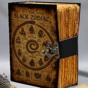 Gothic occult spellbook diary featuring Black Zodiac wheel artwork and rustic antique pages.
