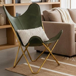 modern butterfly chair, luxury leather chair, designer accent chair, handmade furniture, contemporary seating, leather home decor, vintage style chair, minimalist furniture, reading nook chair, industrial modern chair, premium lounge chair, cozy accent chair, artisan furniture