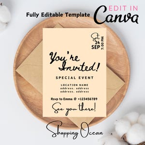 May include: A peach-colored invitation card with black text that reads "You're Invited!"  Special Event. Location Name. address. address. address. address. Rsvp to Emma @ +123456789. See you there! Shopping Ocean. The card is on a wooden plate with a brown envelope.