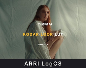 May include: A person with long red hair wearing a white shirt, sitting in front of a white backdrop. The text "KODAK LOOK LUT" is in yellow, with "OWLUTS" below it. The bottom of the image has the text "ARRI LogC3".