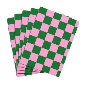 May include: A fan of five rectangular cards featuring a repeating checkerboard pattern in alternating shades of forest green and light pink. Each card has rounded corners and displays a consistent grid layout across the entire surface area.