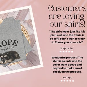 May include: A heather gray t-shirt featuring a Schnauzer dog illustration with the text "Nope not today". The shirt is folded on a woven mat. The image also includes customer reviews.