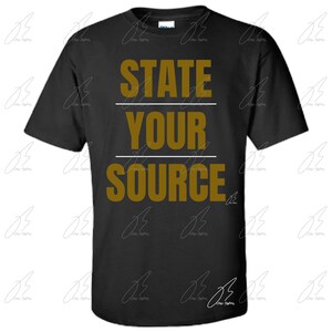 May include: Black t-shirt with the text "STATE YOUR SOURCE" in gold lettering.