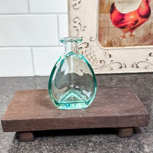 Small light blue glass vase