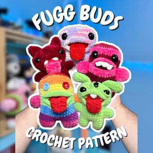 May include: Five small, colorful, handmade crochet plush toys with large black eyes and protruding red tongues, arranged in a cluster. The text FUGG BUDS CROCHET PATTERN is displayed in white letters above and below the group of plush creatures.