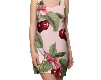 May include: A sleeveless dress featuring a light pink backdrop adorned with a pattern of cherries, green leaves, and pink bows. The cherries are a deep red, and the leaves have a watercolour effect. The dress has a scoop neckline and a fitted silhouette.