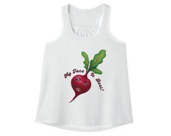 May include: White tank top with a graphic of a beet with a face and the text "My Face is Beet!" in a maroon color. The beet has green leaves and a maroon face with makeup.