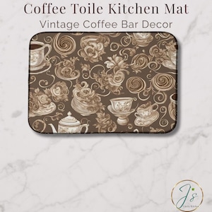 May include: A rectangular kitchen mat with a brown background, featuring a vintage coffee-themed design. The mat displays illustrations of teacups, teapots, and floral patterns. The text "Coffee Toile Kitchen Mat" and "Vintage Coffee Bar Decor" is at the top.