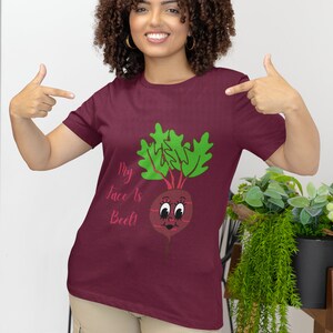 May include: A maroon t-shirt with a graphic of a beet with a face and the text "My face is beet!" printed on it.