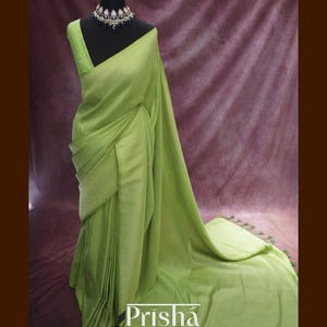 Chinon georgette saree with gold zari box pattern weaving, floral borders&pallu. Available in Parrot Green, Wine, Turquoise Blue. FALL DONE