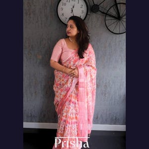 Floral Linen cotton saree with contrast border and pallu, Kantha work all over. Available in Lavender, Grey, Coral & turquoise blue