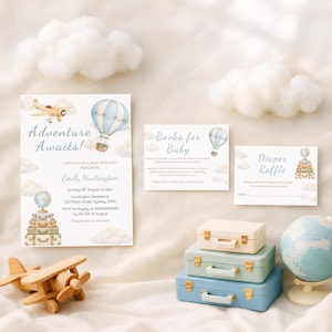 May include: A baby shower stationery set featuring an invitation, a books for baby card, and a diaper raffle card. The designs include watercolour illustrations of a vintage aeroplane, a hot air balloon, clouds, and a stack of suitcases with a globe.