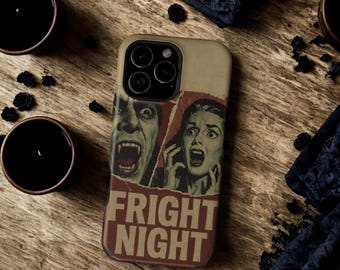 May include: A beige phone case featuring a vintage horror movie poster design. The poster art depicts a screaming woman and a vampire with the words "FRIGHT NIGHT" in bold letters. The case is surrounded by black candles and dark fabric.