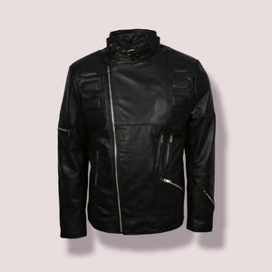 May include: A black leather jacket with a zipper closure and multiple pockets. The jacket has a stand-up collar and a zippered detail on the sleeves.