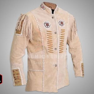 May include: A beige suede jacket with fringe detailing, beaded accents, and a button closure. The jacket has a Native American inspired design.