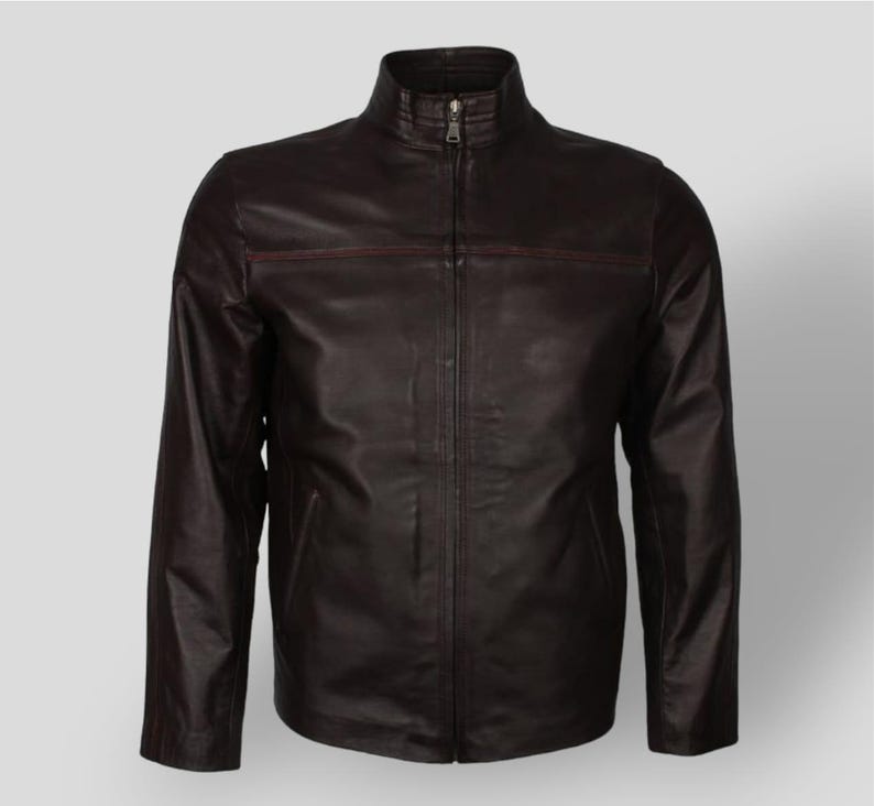 May include: A dark brown leather jacket with a zipper closure and a stand-up collar.