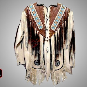 May include: A white leather jacket with brown leather accents and fringe. The jacket has a beaded design on the front and a button closure.