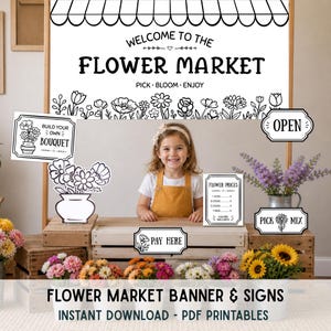 May include: A young girl stands behind a flower market stand with a large banner that reads "Welcome to the Flower Market." The stand features signs like "Build Your Own Bouquet" and "Pay Here." Colorful flowers and sunflowers are displayed.