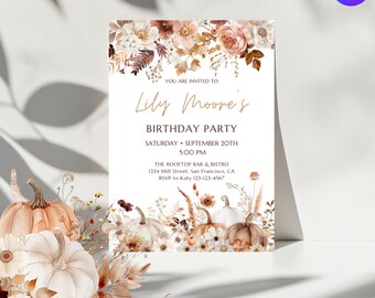 May include: A birthday party invitation with a floral and pumpkin design. The text reads "Lily Moore's Birthday Party" with the date and time. The invitation is decorated with pumpkins and flowers in shades of white, orange, and brown.