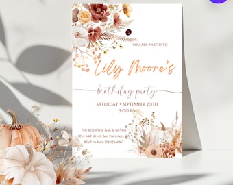 May include: A white invitation card with the text "Lily Moore's birthday party" in elegant script. The card is decorated with floral arrangements in shades of brown, orange, and cream. The event details include the date, time, and location.