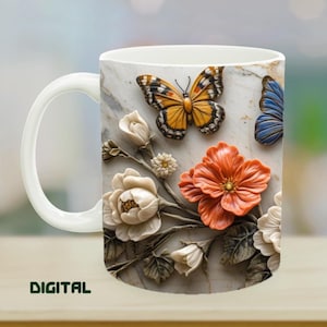 May include: White ceramic mug featuring a detailed design of butterflies and flowers in shades of orange, yellow, and white. The mug has a white handle and the word "DIGITAL" is printed on the bottom left.