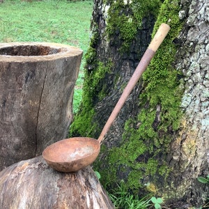 An old metal handled ladle 14 inches. A possible metal/steel smelting ladle. Unmarked