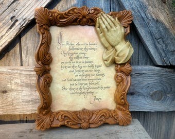 A vintage (1960s-70s) 8x10 framed "The Lord's Prayer" The plaque is made of a hard plastic or resin material designed to look wood carved