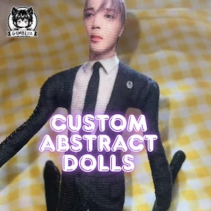 May include: A custom abstract doll in a black suit, white shirt, and black tie. The doll has a realistic face, with the text "CUSTOM ABSTRACT DOLLS" overlaid. The background features a yellow and white checkered pattern.