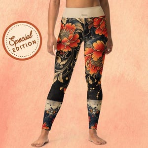 May include: Special Edition leggings with a floral design. The leggings feature a black background with large orange and red flowers and gold accents. The waistband is a light beige color.