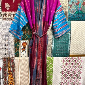May include: A long, purple, blue, and gray silk robe with a tie belt. The robe has a tie belt and is made of a soft, flowing fabric.