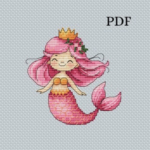 Puede incluir: Una sirena rosa con una corona dorada y una corona floral verde. Tiene una cola rosa con un patrón de escamas amarillas y naranjas. La imagen está sobre un fondo gris con la palabra "PDF" en la esquina superior derecha.