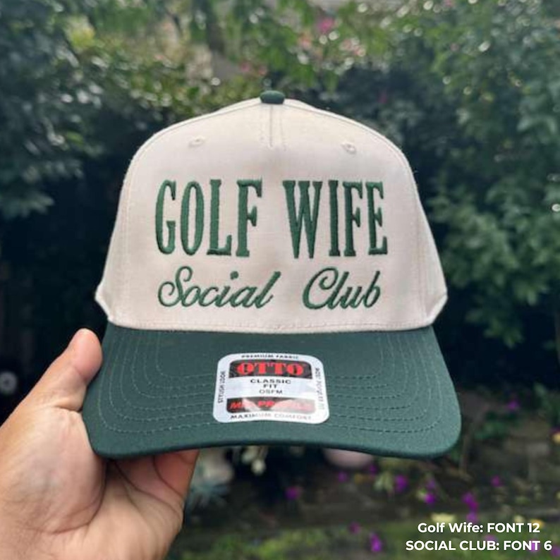 May include: A beige and green baseball cap with the text "GOLF WIFE Social Club" embroidered in green. The cap has a curved brim and a structured crown. The brand tag "OTTO" is visible.