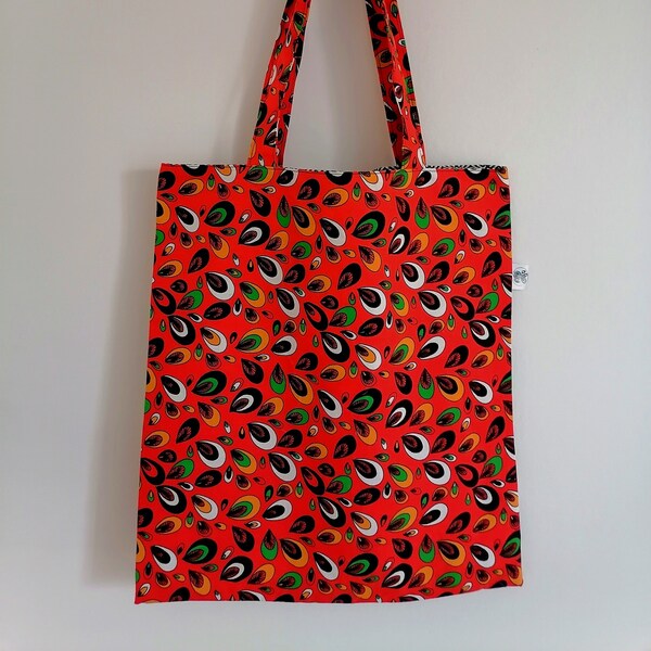 Tote bag avec doublure et réversible, tissu type africain orange à motif/tissu à chevrons noir et blanc