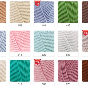 K&ouml;nnte beinhalten: Eine Sammlung von Garnkn&auml;ueln in verschiedenen Farben, darunter Beige, Blau, Gr&uuml;n und Braun. Jedes Kn&auml;uel ist mit einer Nummer versehen. Einige Kn&auml;uel haben ein "NEU"-Etikett. Das Garn scheint weich und f&uuml;r Strick- oder H&auml;kelprojekte geeignet zu sein.