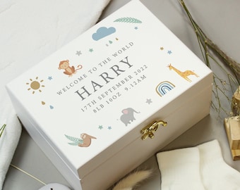 May include: White wooden keepsake box with a gold latch. The box is decorated with a blue cloud, raindrops, stars, a sun, a monkey, a sloth, an elephant, a giraffe, and a rainbow. The text on the box reads "Welcome to the world Harry 17th September 2022 8lb 10oz 9:12am".