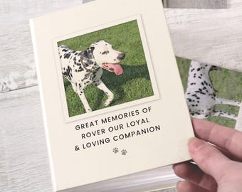 May include: A white photo album with a black and white photo of a Dalmatian dog on the front. The album has the text "Great Memories of Rover Our Loyal & Loving Companion" printed on the front.