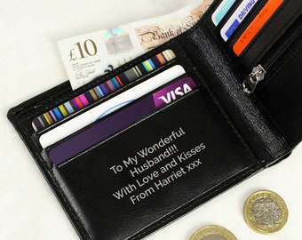 May include: Black leather wallet, open to reveal cards, cash, and a zipper pocket. The interior features the text "To My Wonderful Husband!!! With Love and Kisses From Harriet xxx". Several coins are visible.