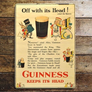 May include: Vintage Guinness beer advertisement poster featuring Alice in Wonderland characters. The poster features a glass of Guinness with the text "Off with its Head!" and "Guinness Keeps its Head!"