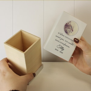 May include: White wooden box with a white lid. The lid has a photo of a cat and the text "If love could have saved you, you would have lived forever Tilly 2018 - 2025".